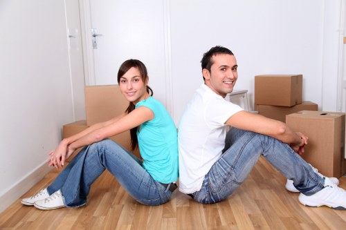 Professional movers handling furniture during a flat move in Kingston
